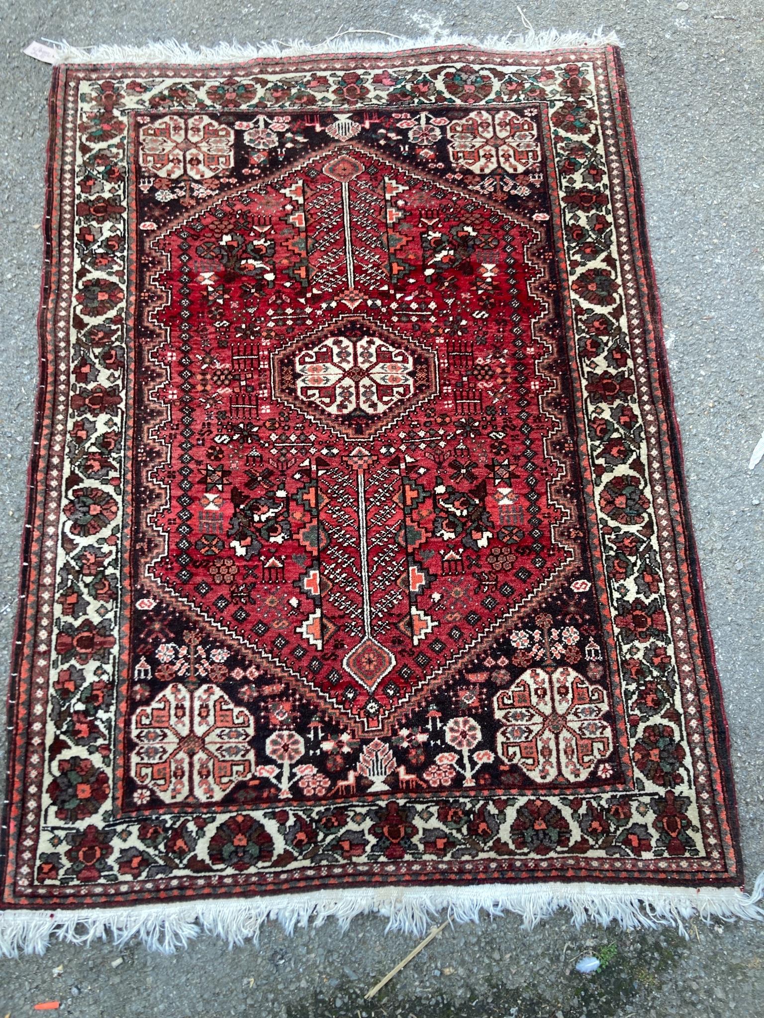 A Belouch red ground rug, 148 x 108cm
